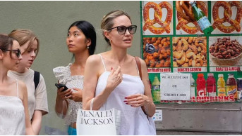 Angelina Jolie conquered New York in a snow-white dress: a walk with her daughter Vivienne