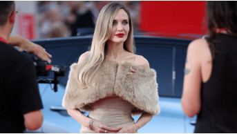 Angelina Jolie shocked everyone at the Venice Film Festival by kneeling for a paralyzed fan