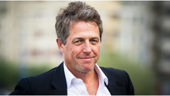 Hugh Grant Faces Unexpected Airport Drama: Family Ties Questioned