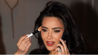 Kim Kardashian impresses: new emotional pictures in a red corset dress