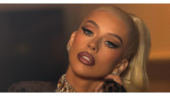Christina Aguilera impresses in gold shorts at the opening of H&M