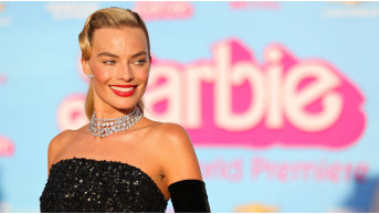 Margot Robbie is enjoying the sun in Italy while expecting her first child
