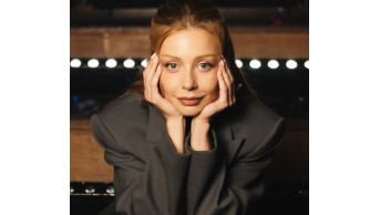 Tina Karol's Enigmatic Smile Captivates Fashion World